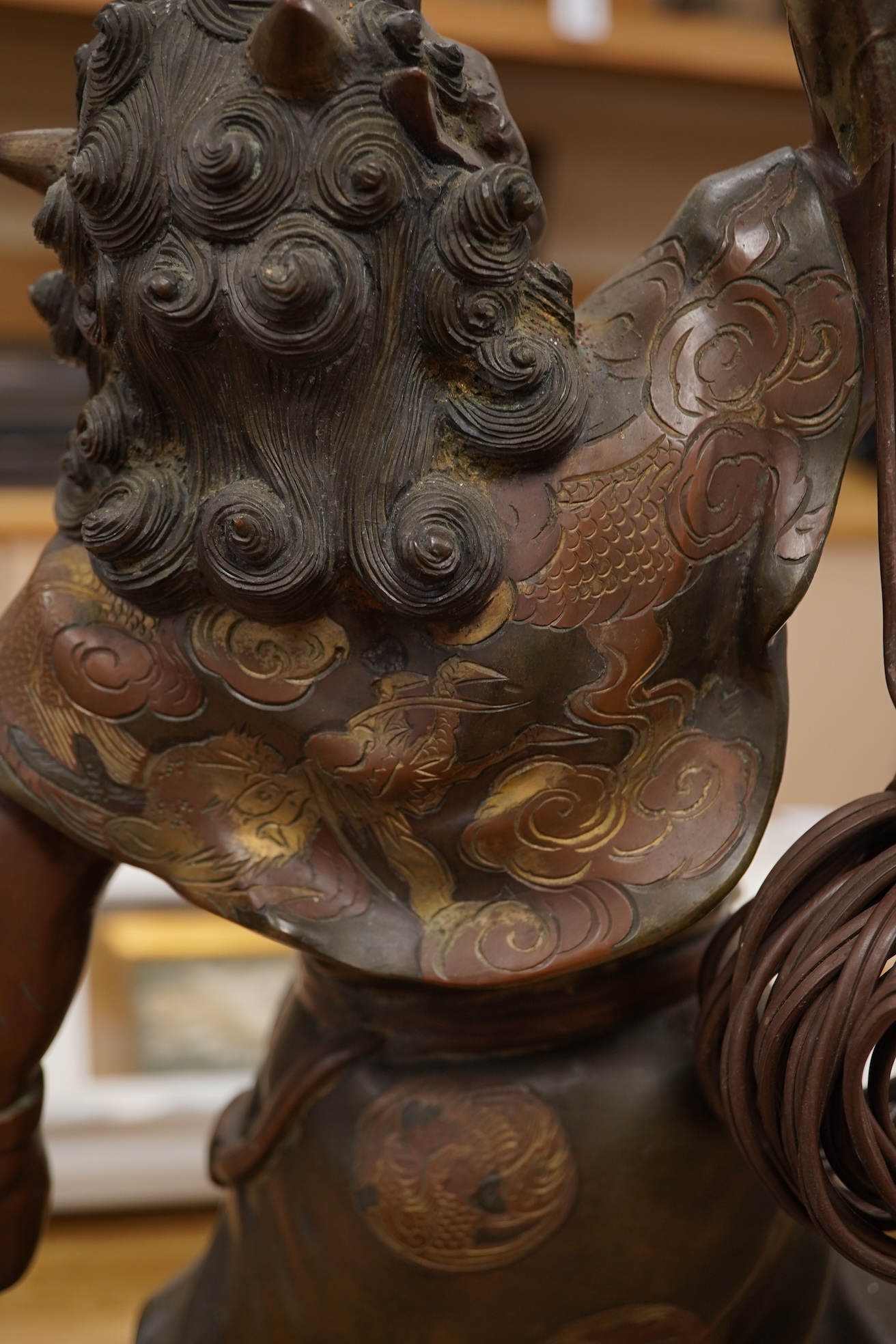 A Japanese bronze model of an oni, Meiji period, now mounted as a lamp, 50cm